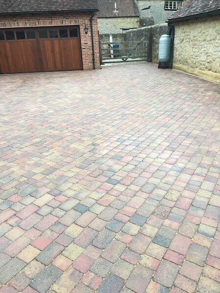 Block paving parking area after cleaning by The Driveway Doctor