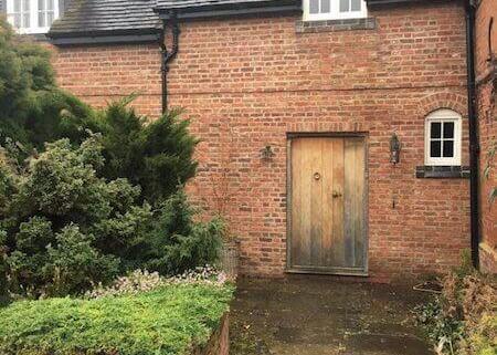 Cottage pathway before a Driveway Doctor clean